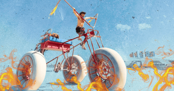 A shirtless white man riding a giant tricycle in the desert surrounded by flames on a blue background.