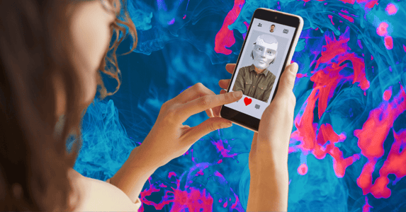 A woman holding a smartphone with a dating app open to a photo of a robot.