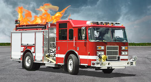 A red fire truck appears to be on fire on its top, against a dramatic, cloudy sky.