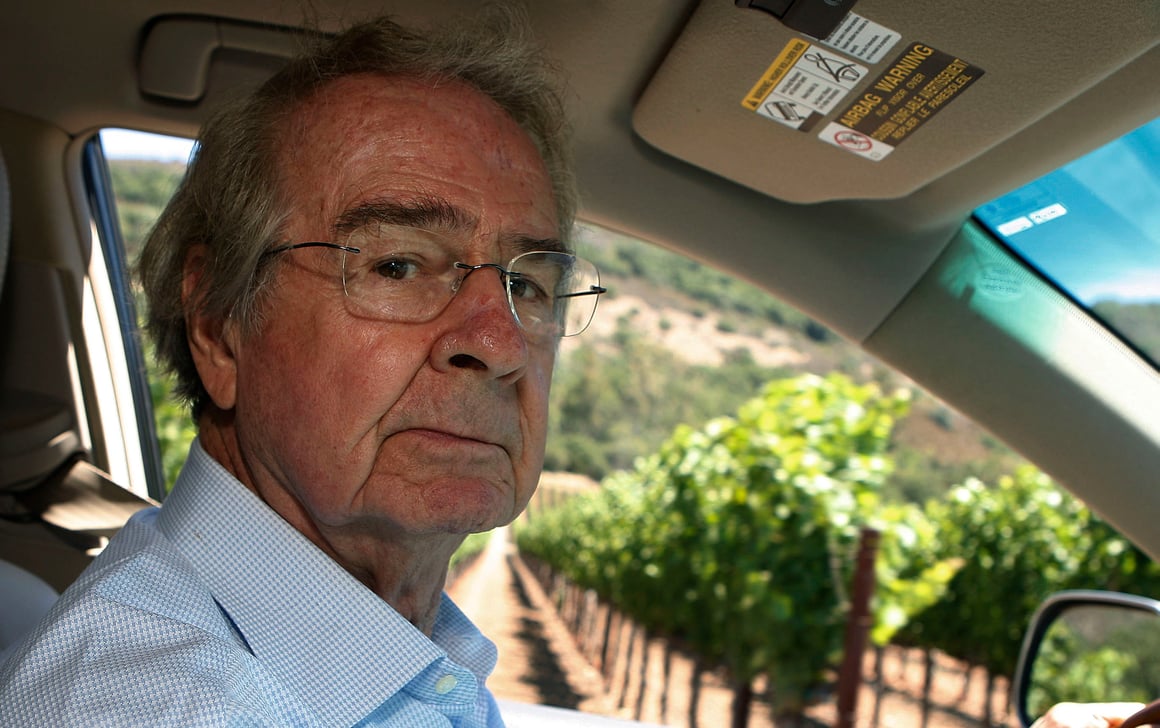 Warren Wisniarski in a car with Napa Valley vineyards in the background