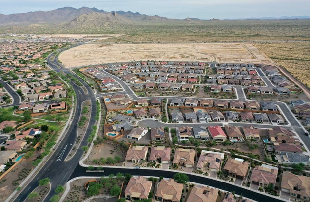 Aerial view of Buckeye AZ suburban subdivision surrounded by desert landscape