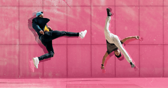 Two men mid-air flipping 