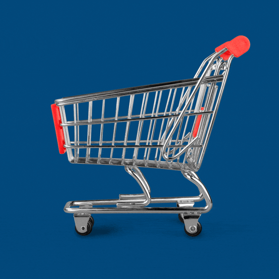 A hand pushing a grocery shopping cart. 