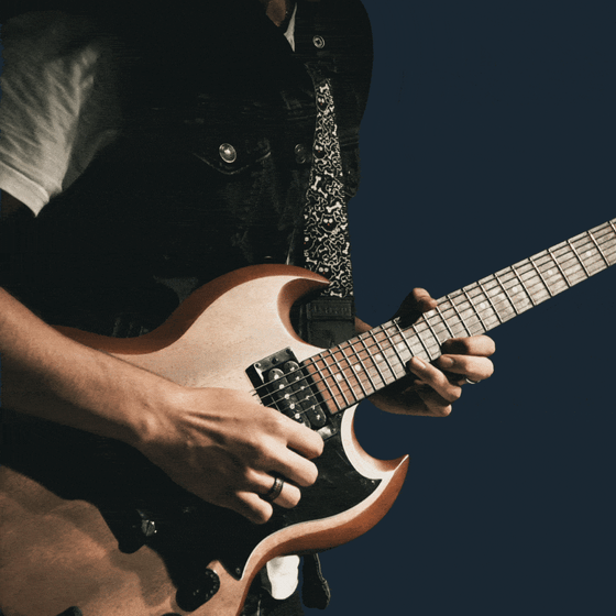 Strumming a guitar