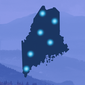 An outline of the state of Maine with several lights blinking off.
