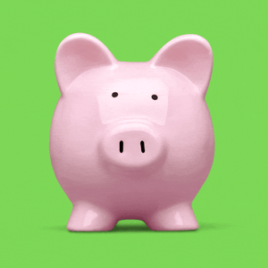 A piggy bank cracking with a quarter rolling out