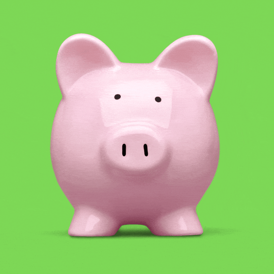 A piggy bank cracking with a quarter rolling out