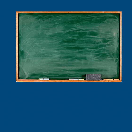Robot in front of a chalk board