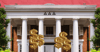 A sorority house with money sign balloons 