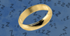 A gold ring with zzzs in the background