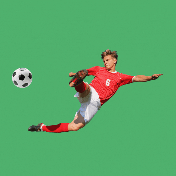 A soccer player kicking a ball.