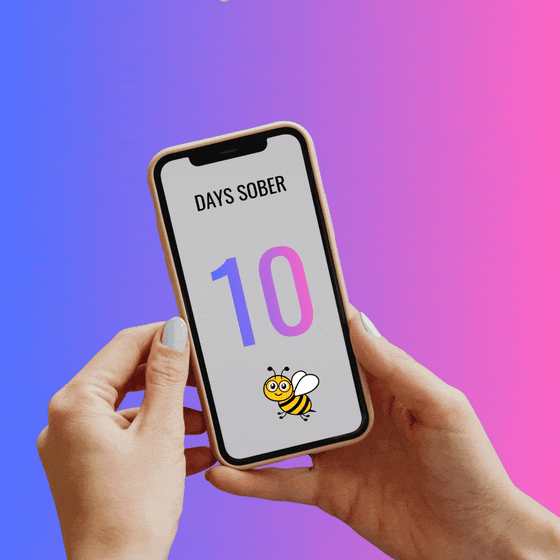 Two hands hold a phone. Its screen reads 