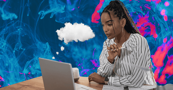 A Black woman in a white shirt looking at a silver laptop and holding a pen on a pink and blue swirled background. 