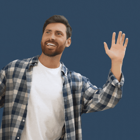 A white man waving 