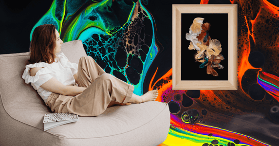 A woman lounges in a chair while observing a piece of art. 