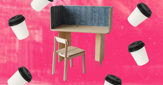 A wooden test with a blue interior panel surrounded by coffee cups. 