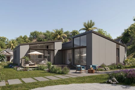 A brown house with huge windows on a summer day.