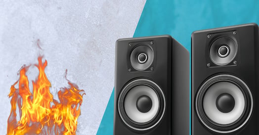 Two subwoofers face off against a fire.