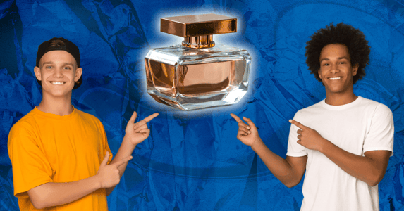 Two teenage boys pointing to a bottle of perfume.