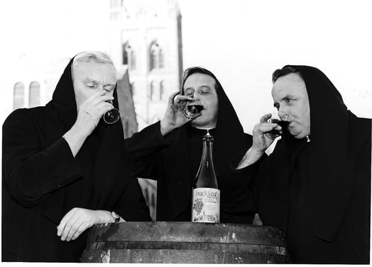 Three monks take a sip of tonic wine
