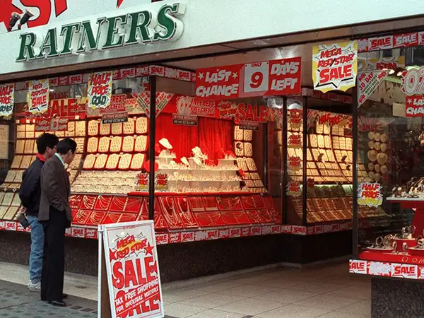 A Ratners jewelry store in 1991, complete with garish advertisements (via Getty Images)